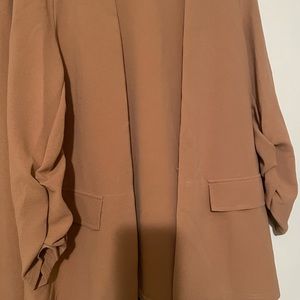 Beautiful tan colored suit.  Never worn. Size 12.